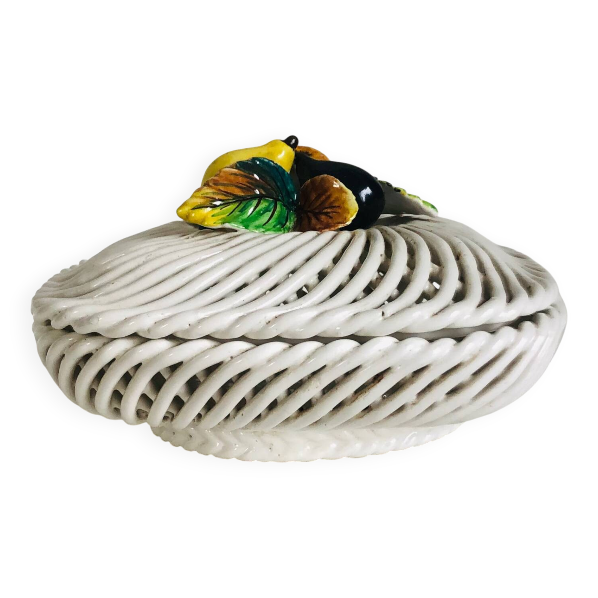 Covered basket in woven ceramic and fruit slip.
