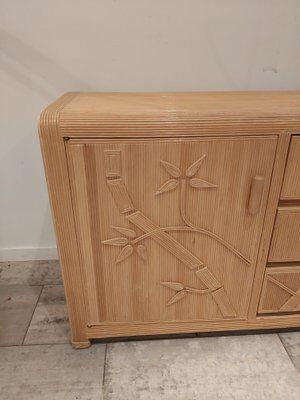 Vintage wicker sideboard with flowers