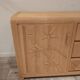 Vintage wicker sideboard with flowers