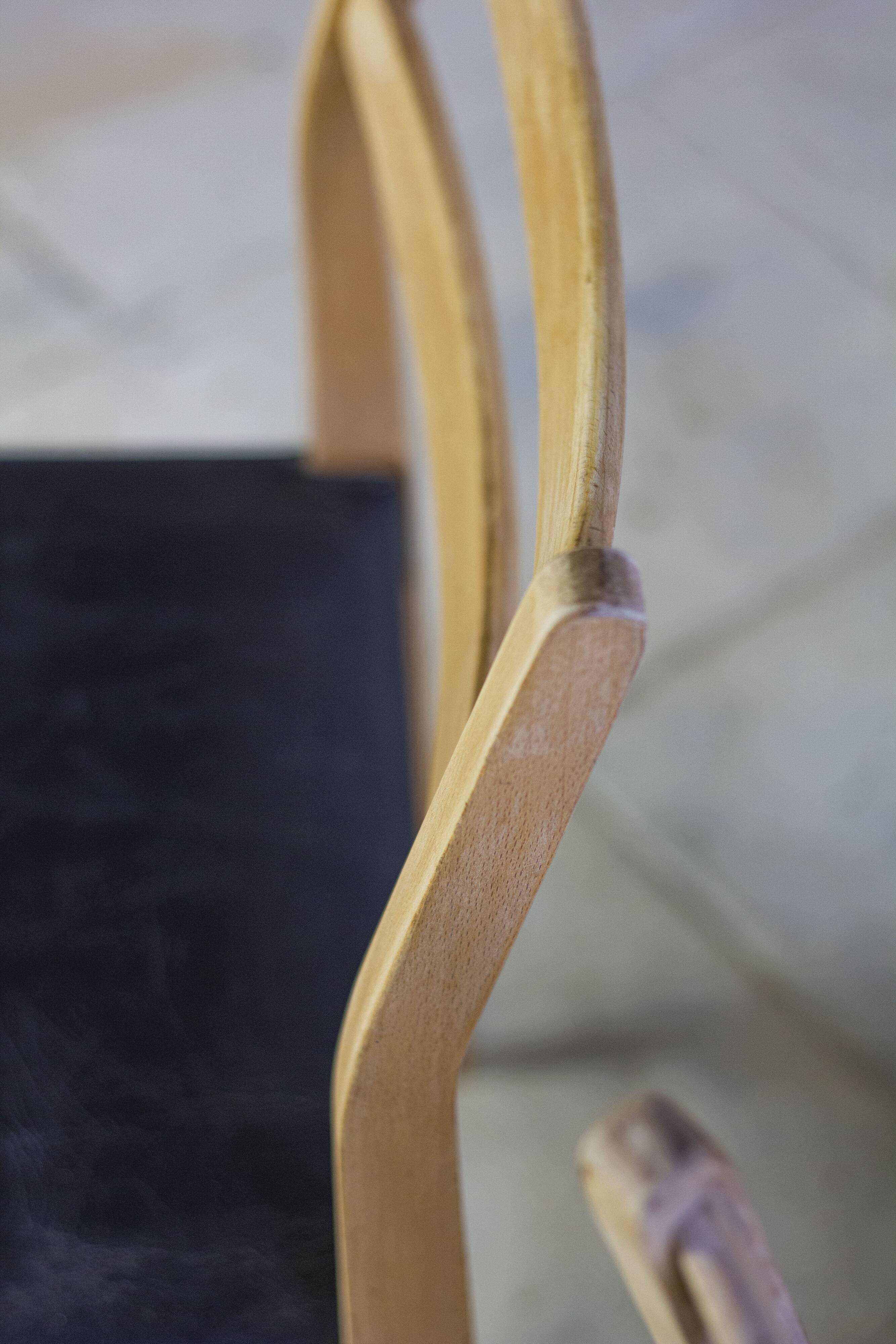 Scandinavian chair in teak and faux leather, 1960.