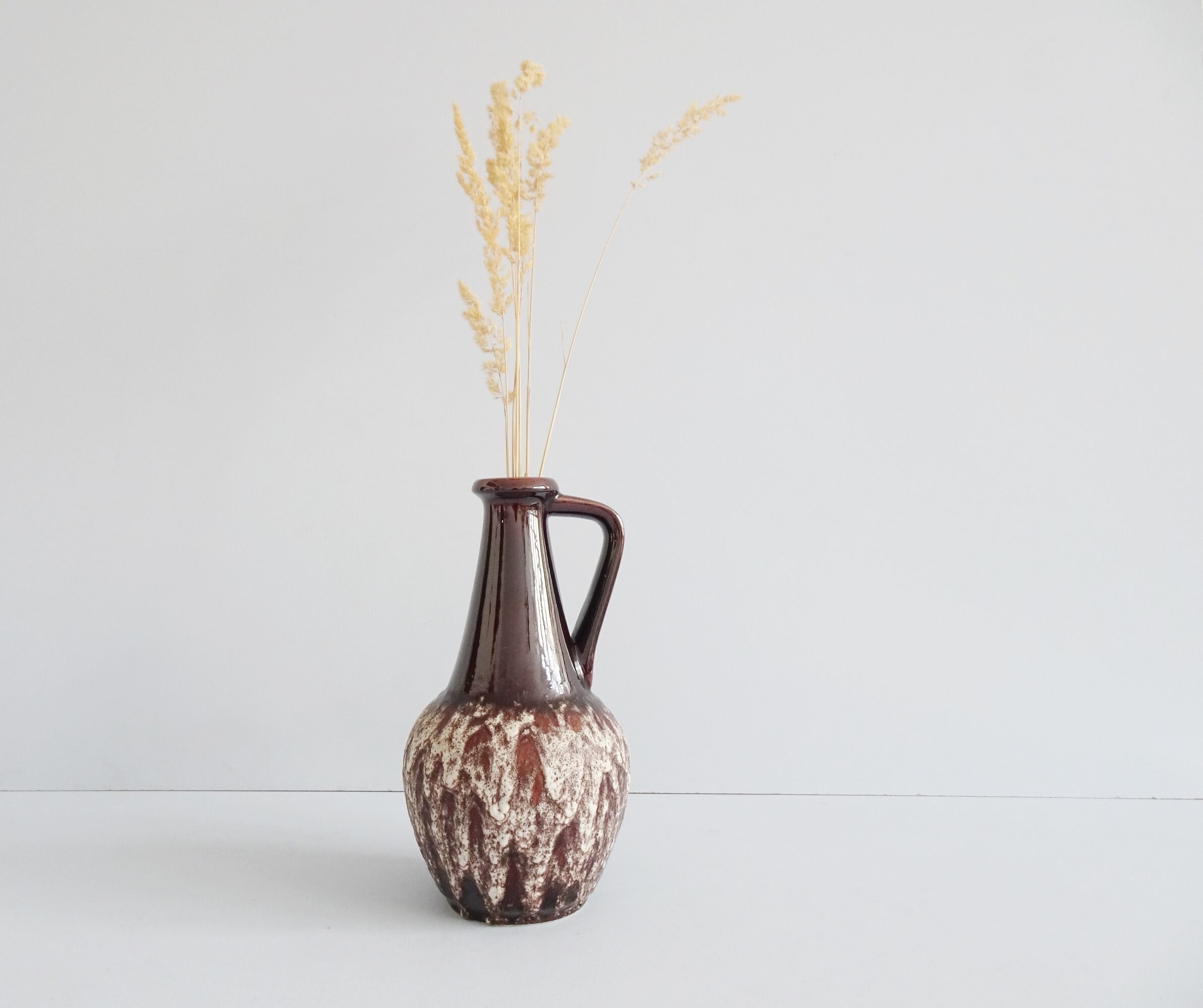 Bay ceramic pitcher with handle and fat lava glaze
