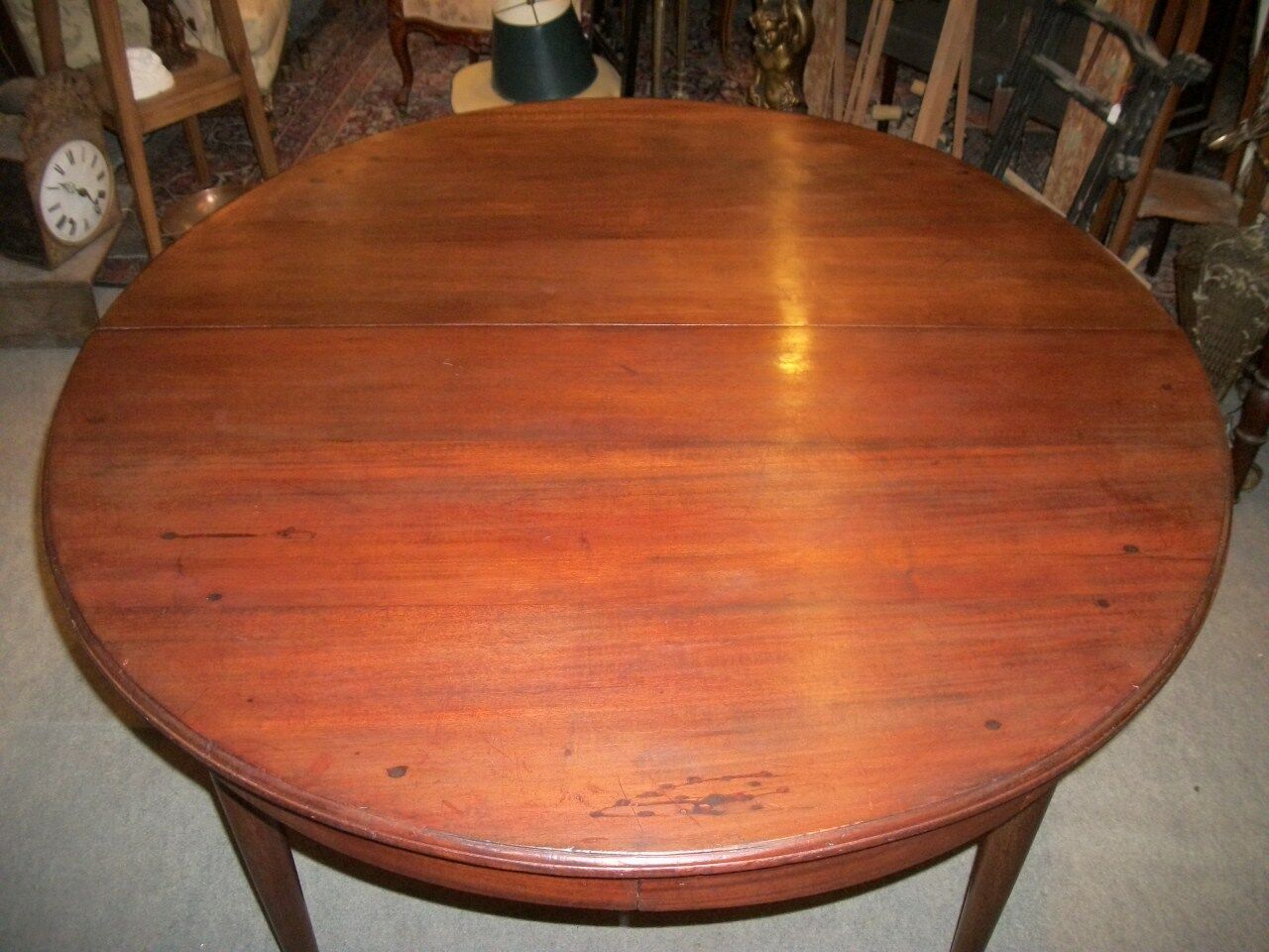 Oval mahogany table with extension cords