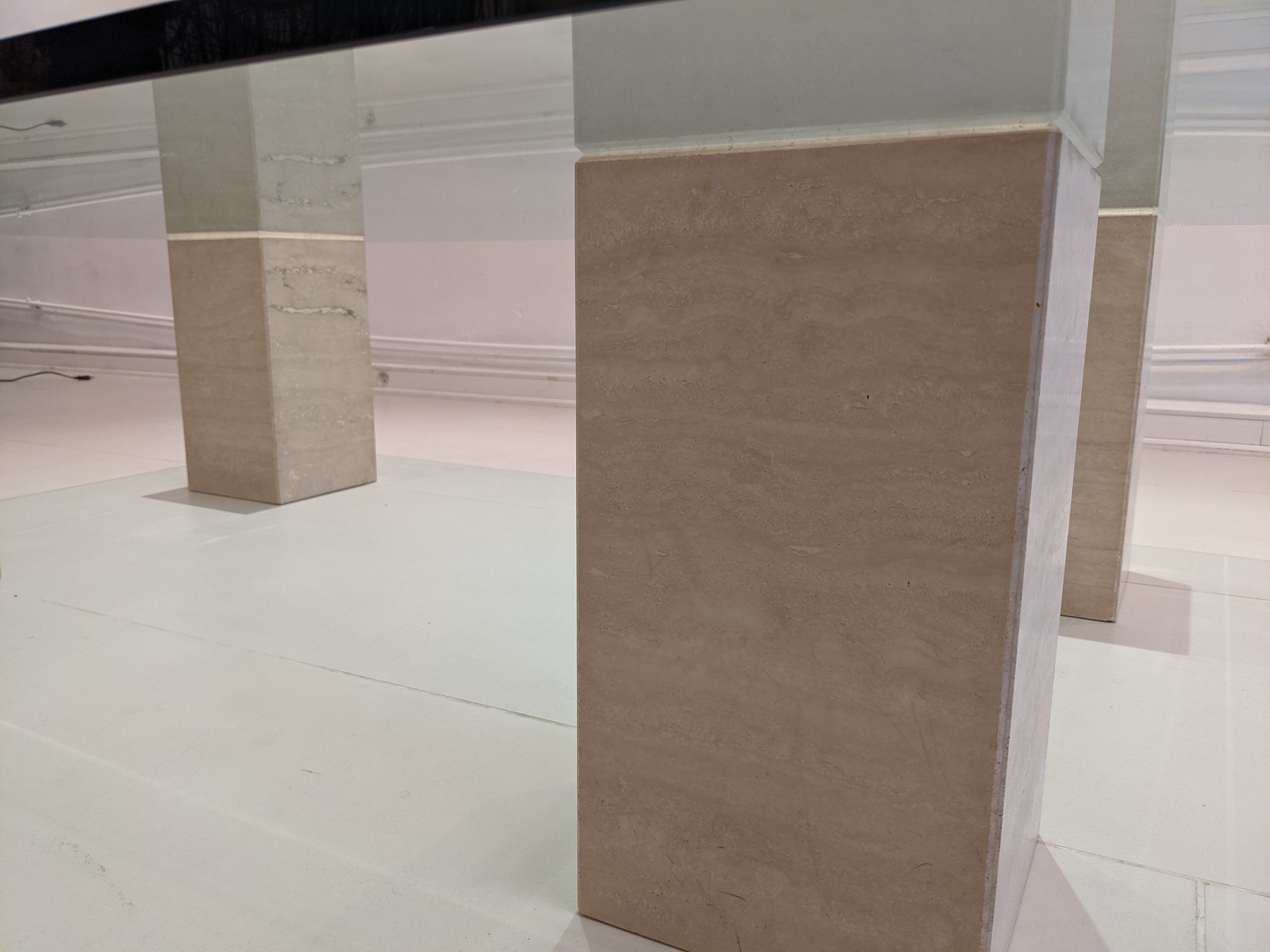 Glass table and travertine feet