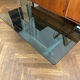 70s design coffee table in rectangular glass with chrome legs.
