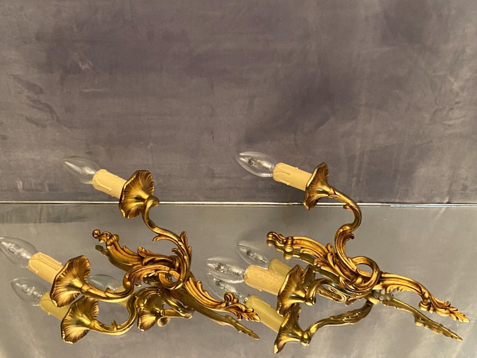 Pair of Louis XV style gilded bronze sconces