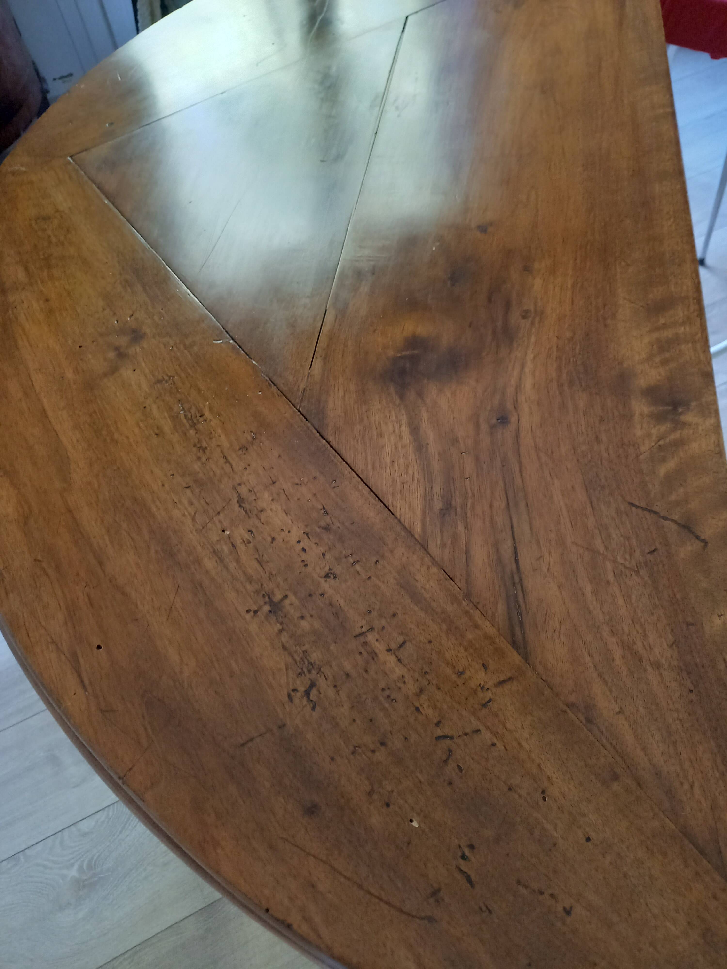 Antique half-moon walnut round table