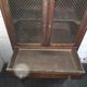 Vintage oak furniture with mesh doors.