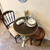 Bistro table in gray cast iron and brown melamine