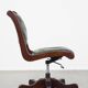 English Chesterfield office chair in green leather, height adjustable on casters