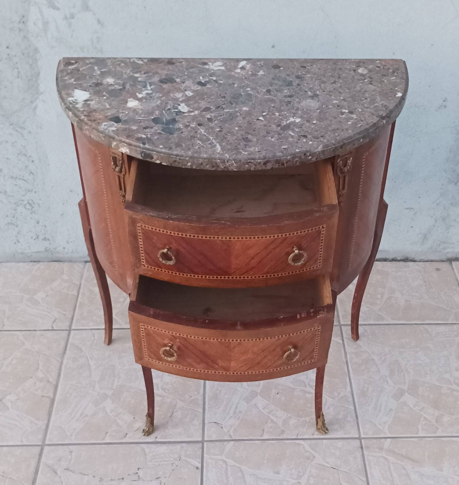 Half-moon commode in Louis XV style with walnut veneer.