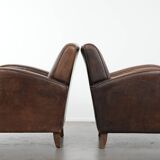 Set of two vintage sheepskin leather design armchairs in a cognac colour