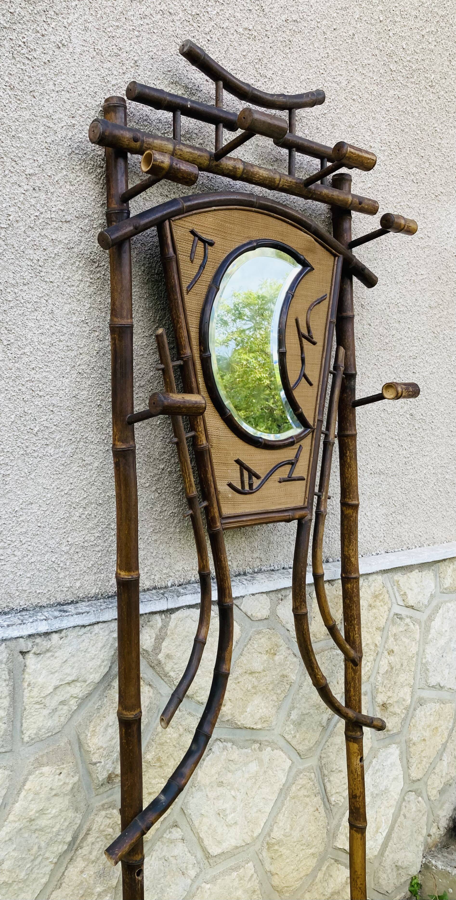 Bamboo coat rack from the 19th century, mirror in the shape of a crescent moon.