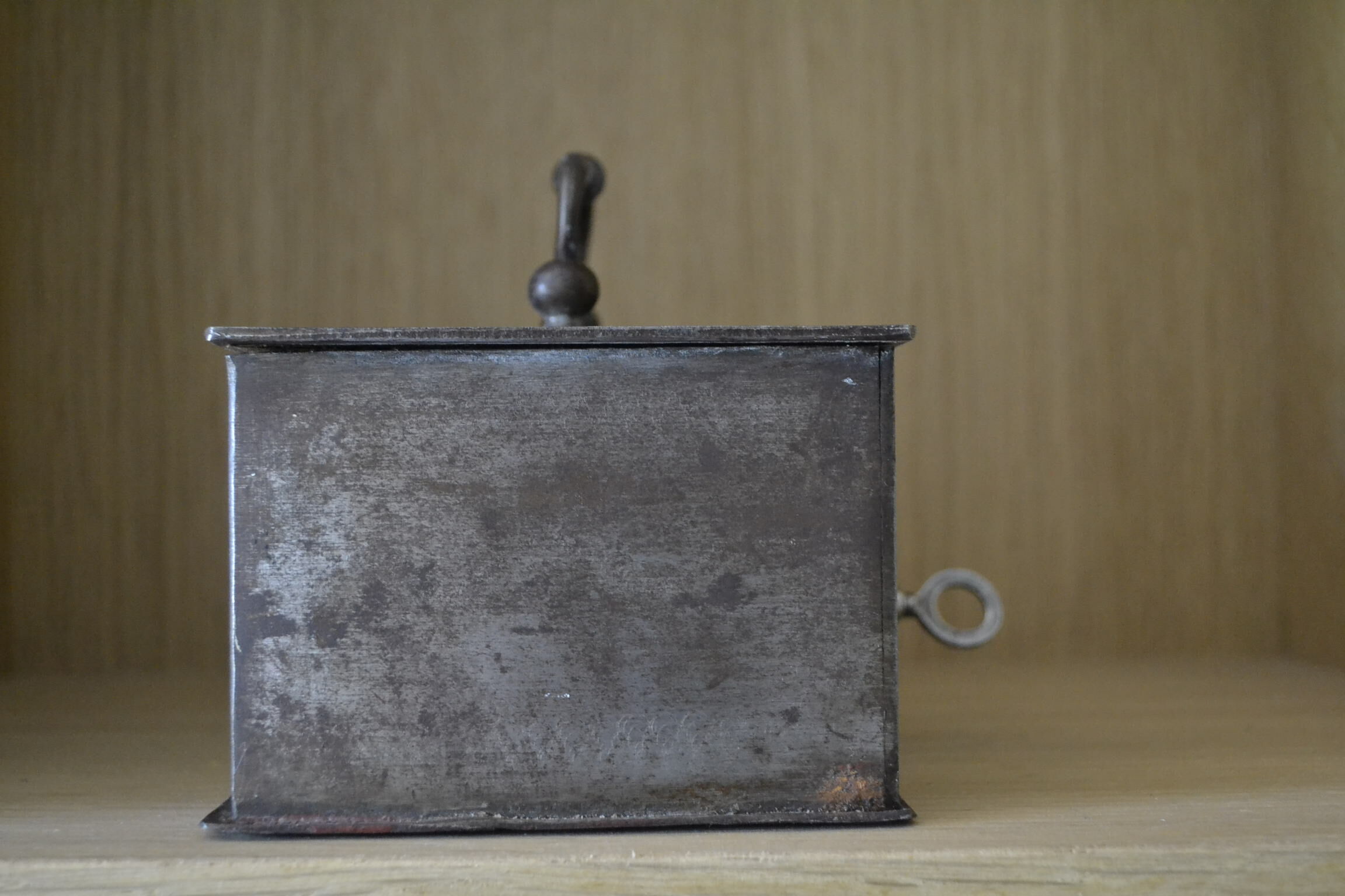 Cashier, patinated safe with its key