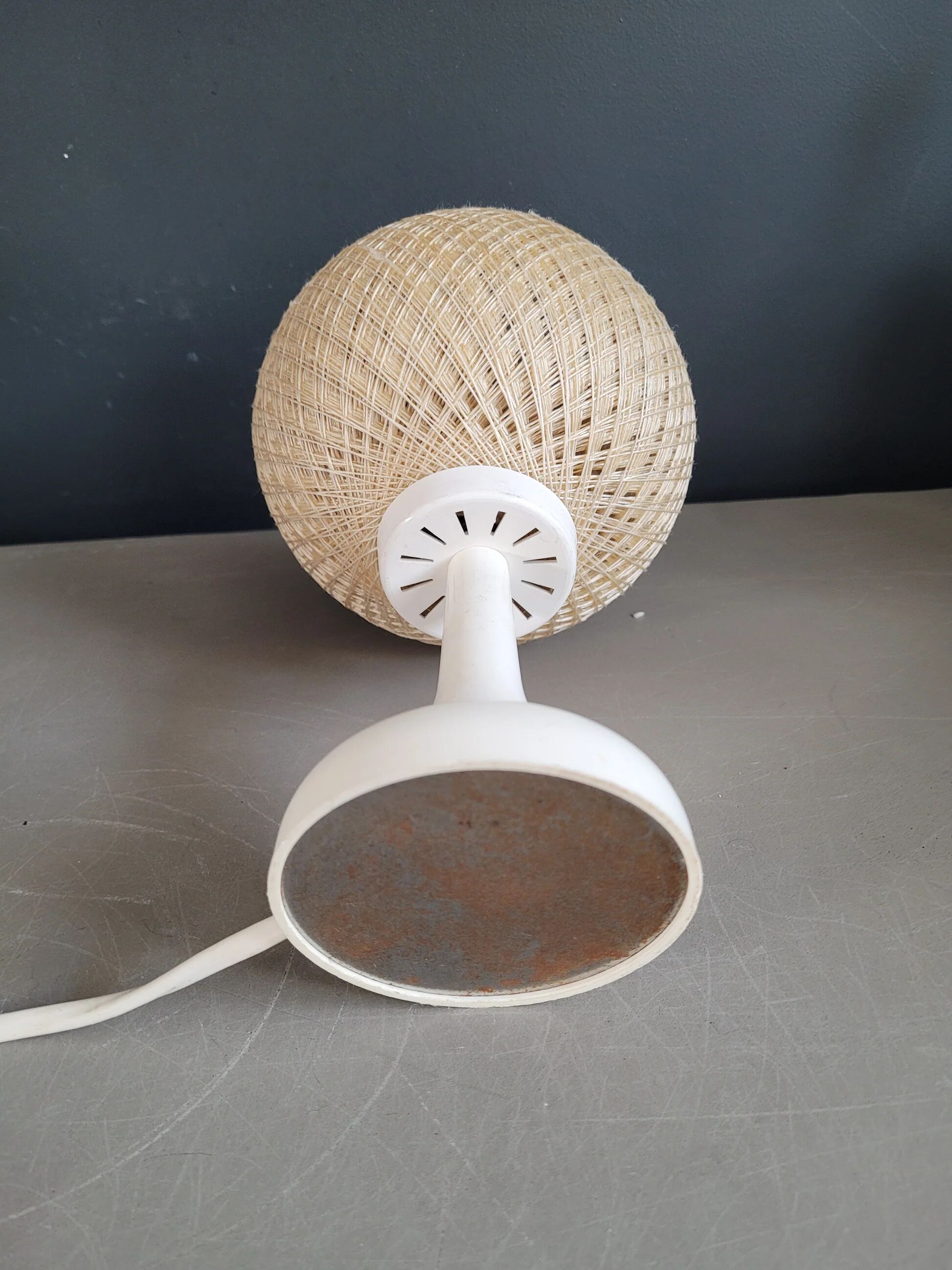 60's table lamp with tulip base and stretched wire shade.