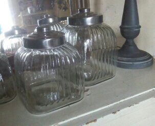 three large glass jars