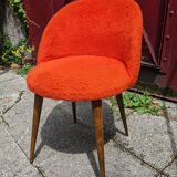 Orange furry barrel chair