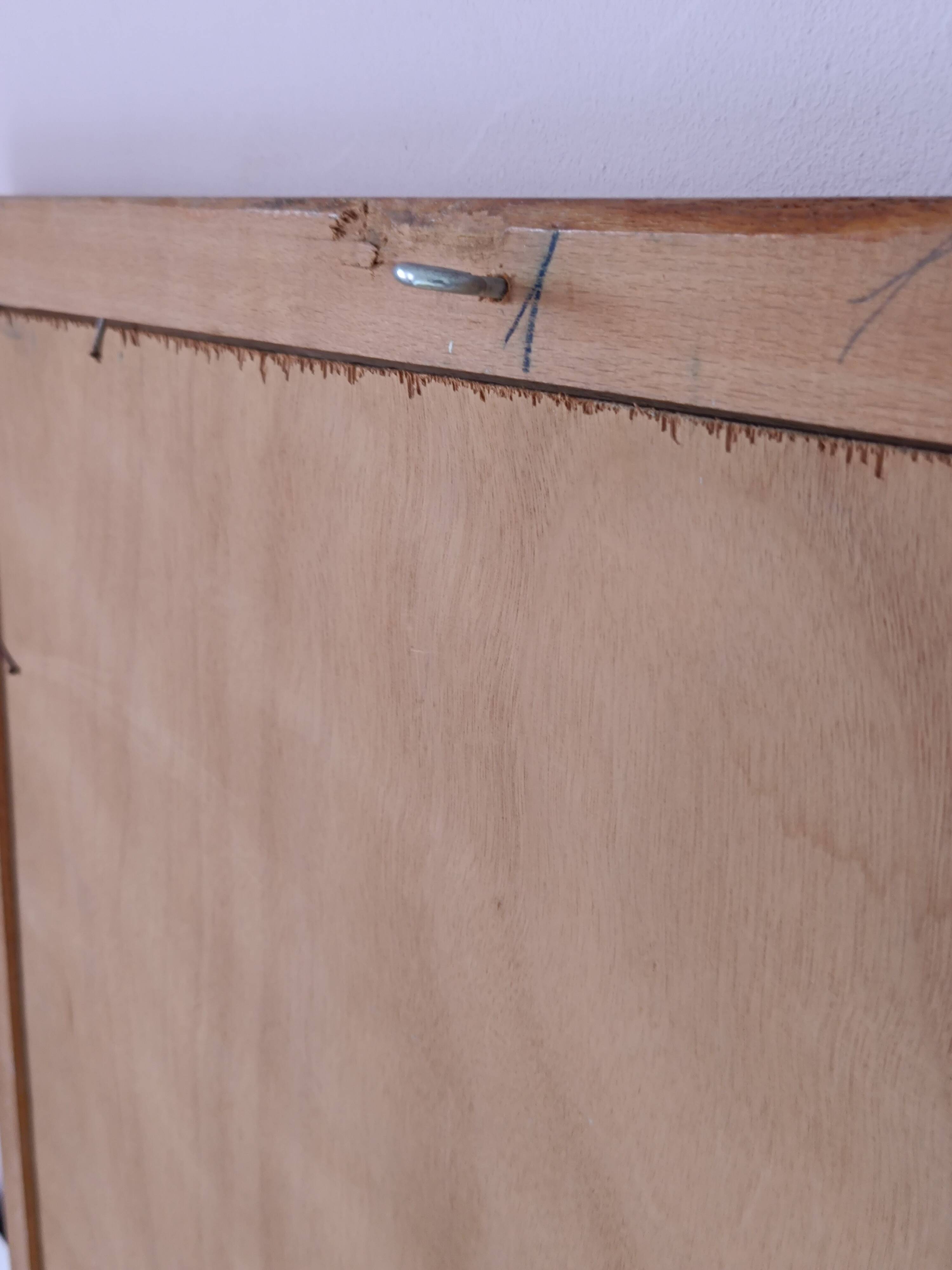 Beveled glass wall mirror in solid wood frame