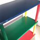Shelf on legs, library, crayons in 4 colours.