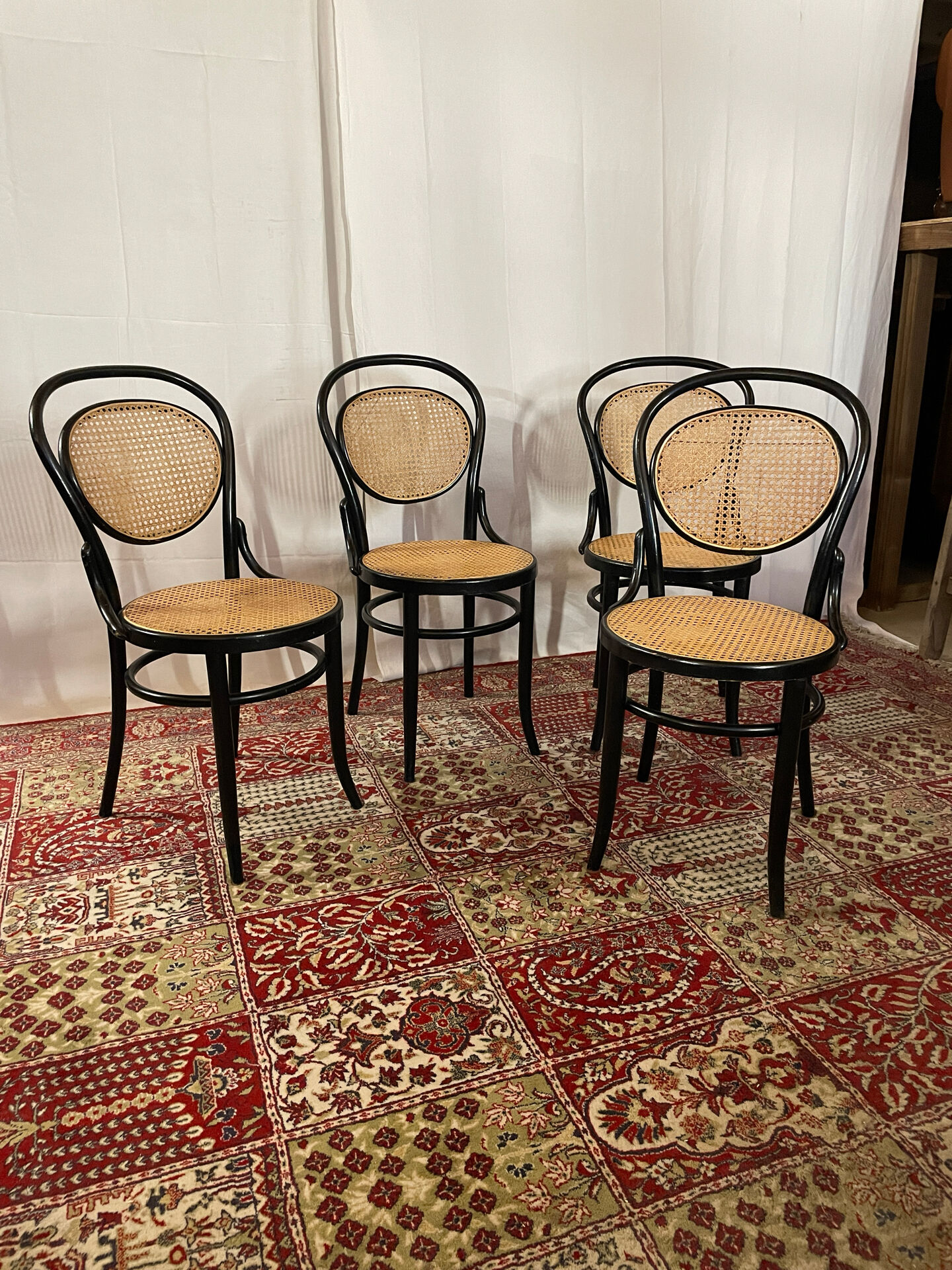 Set of 4 bentwood bistro chairs in black with caning.