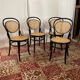 Set of 4 bentwood bistro chairs in black with caning.