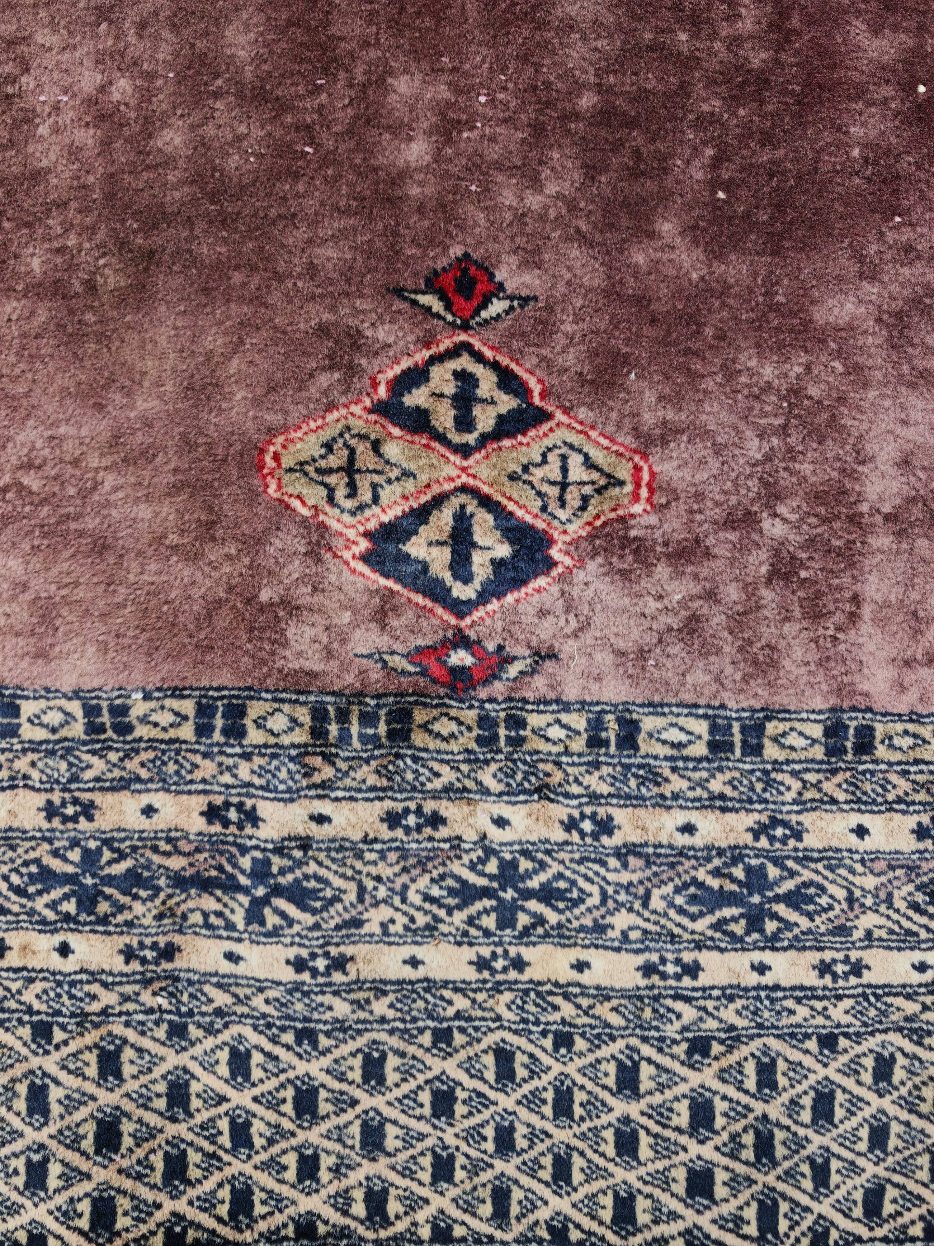 Vintage Anatolian prayer rug made of hand-knotted wool.