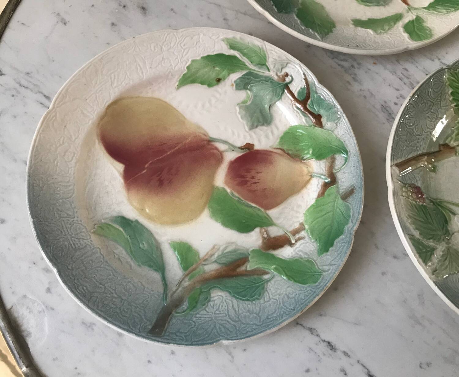 Trio of St Clement dessert plates in 19th century slip