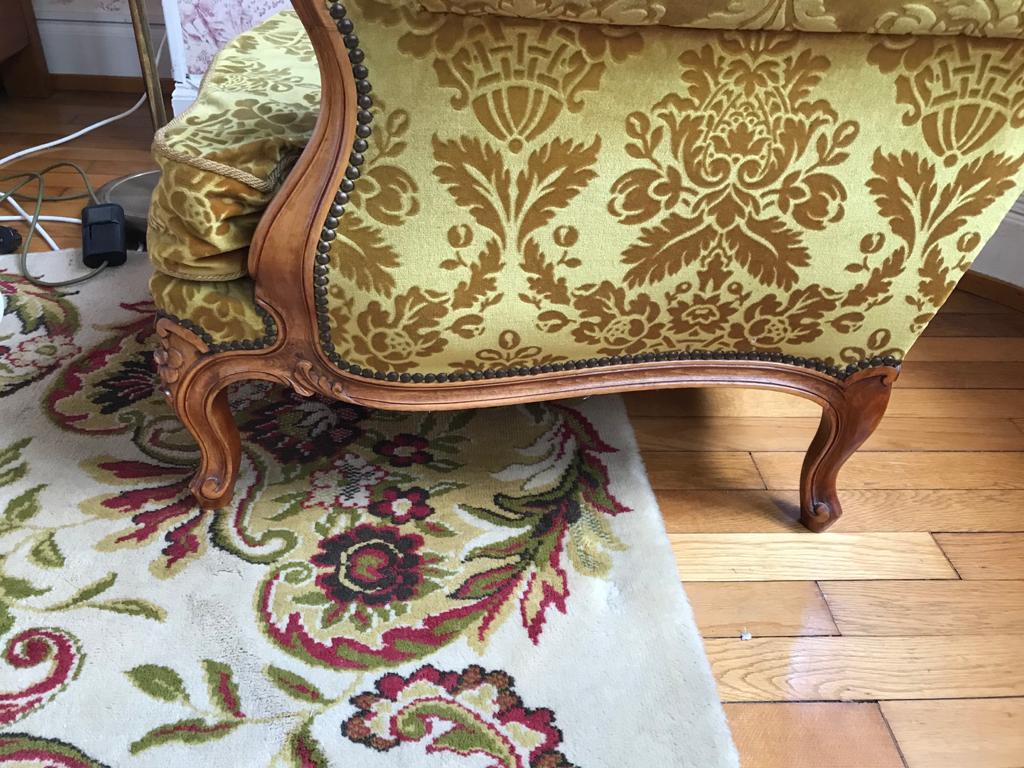 Armchair in golden yellow velvet and louis XV style cherry tree