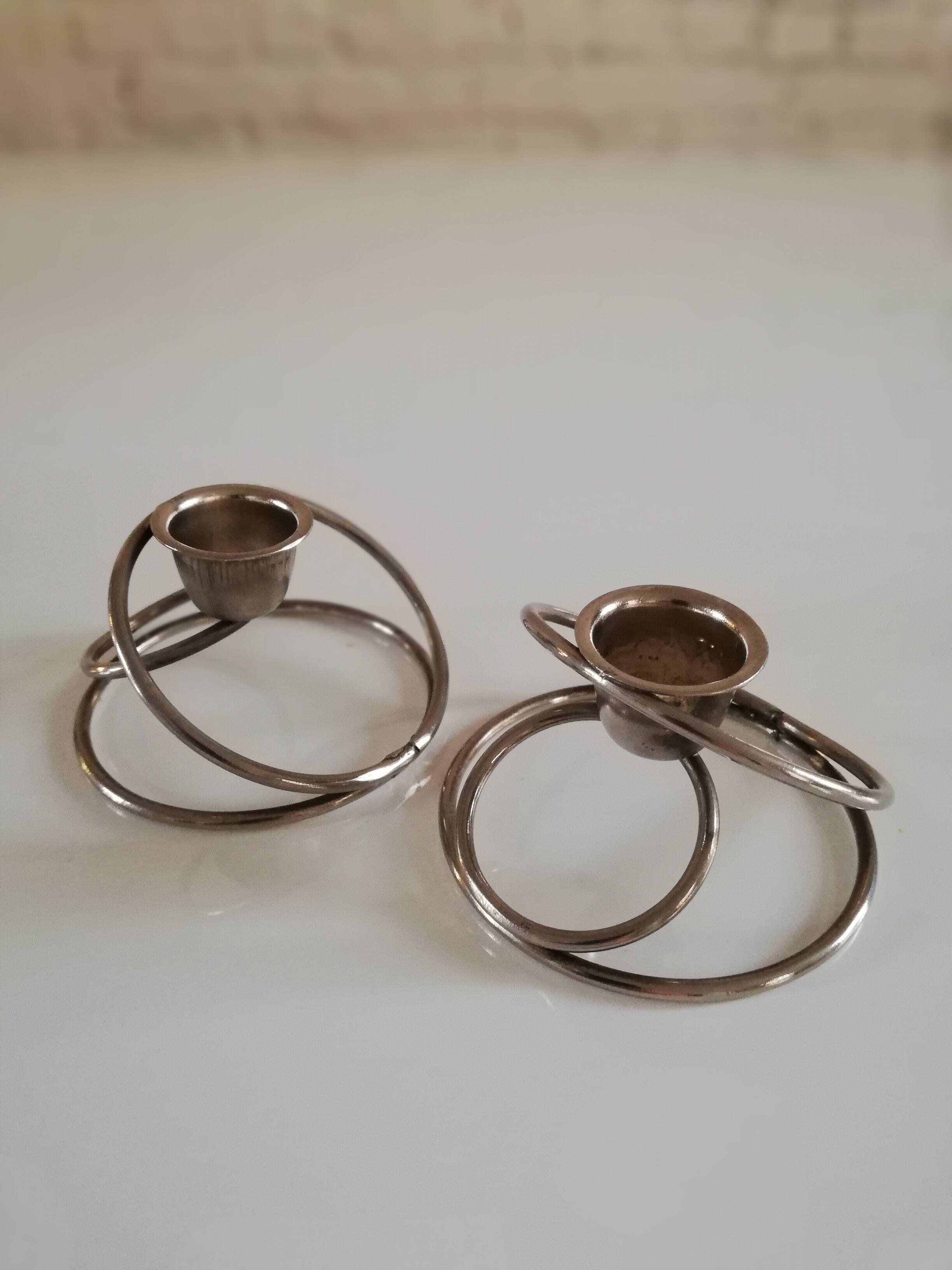 Pair of white metal candle holders