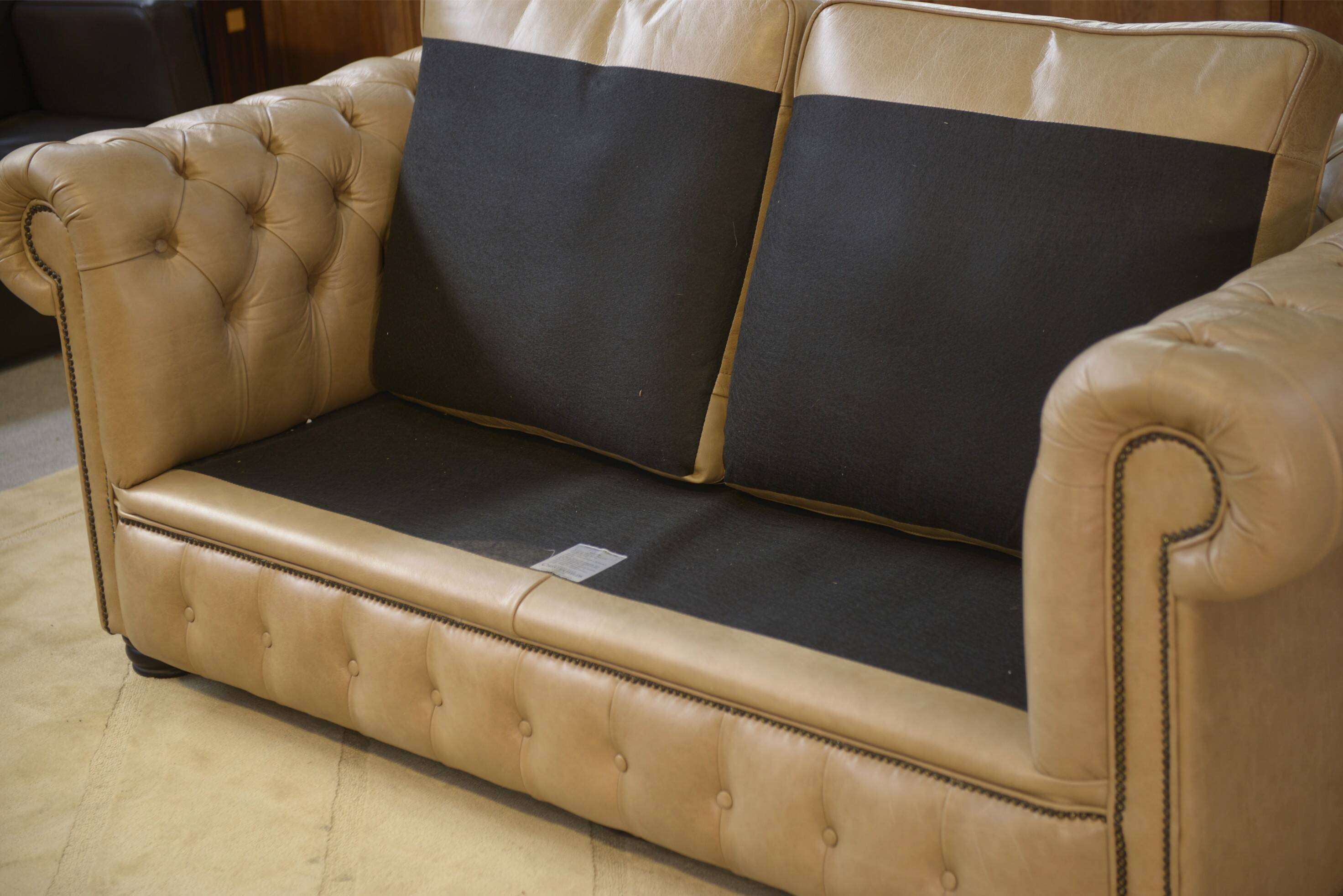 Beige leather Chesterfield sofa handmade in England.
