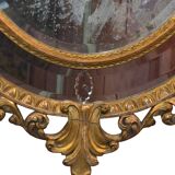Miroir ovale en bois doré