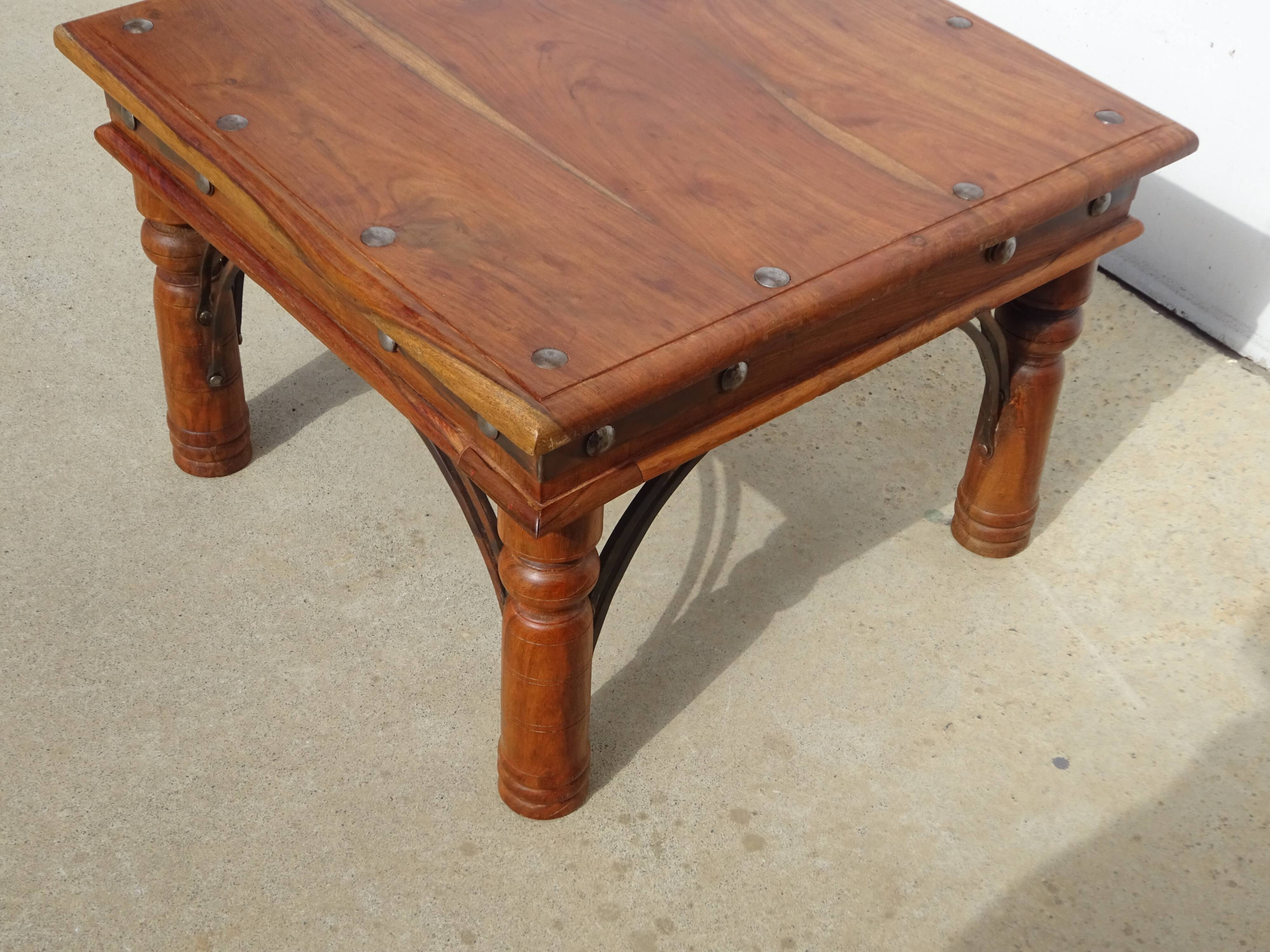 Square coffee table in exotic wood and wrought iron.