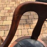 Pair of antique brown swivel armchairs in upholstery fabric, wooden frame, Hungary circa 1900.