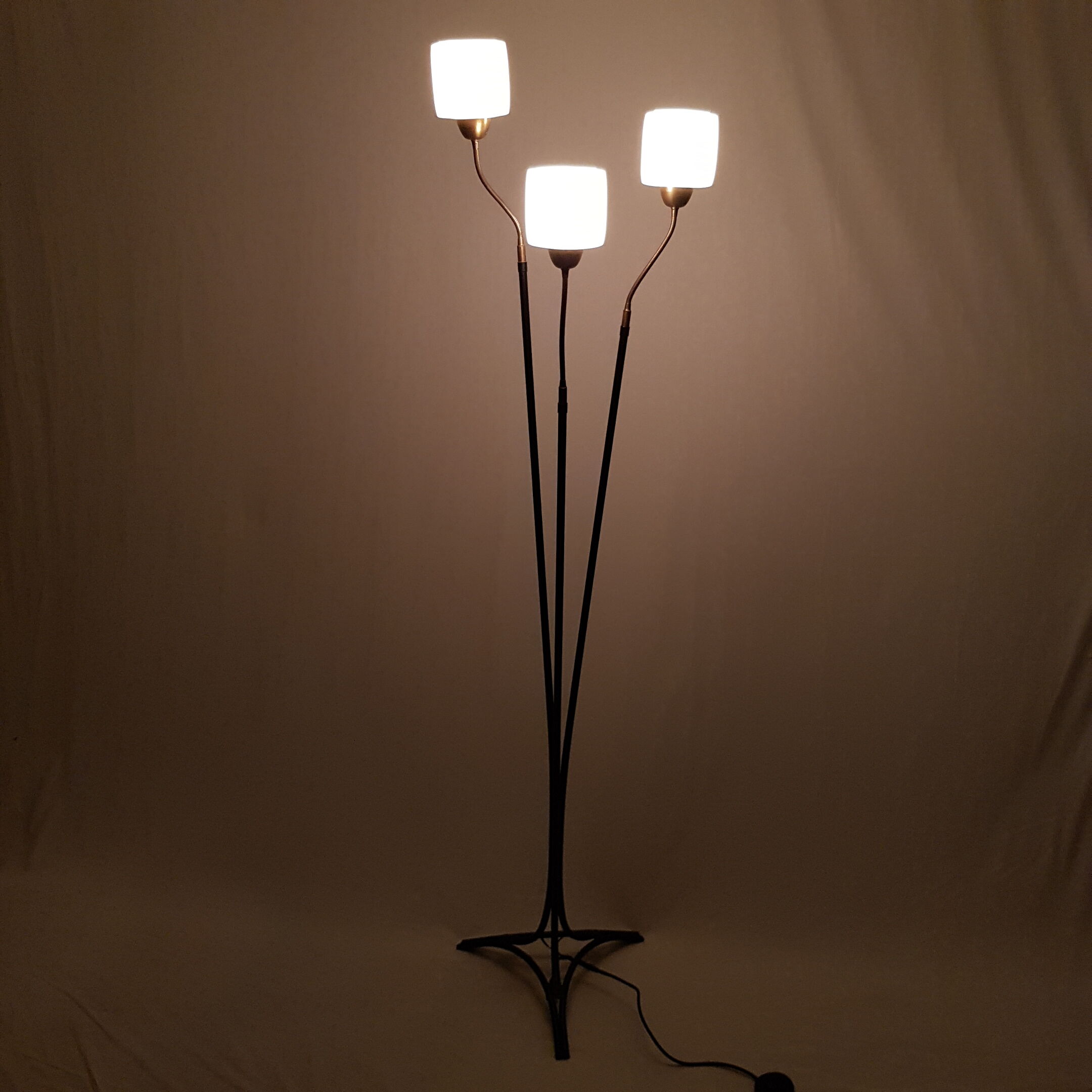 Golden brass tripod lamppost