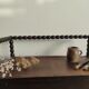 Natural wood chest forming a bench, ringed shoulders