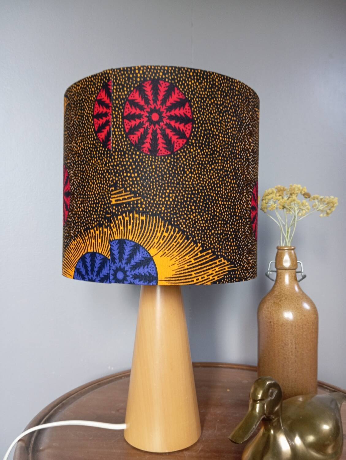 Table lamp in blond wood with handmade wax shade
