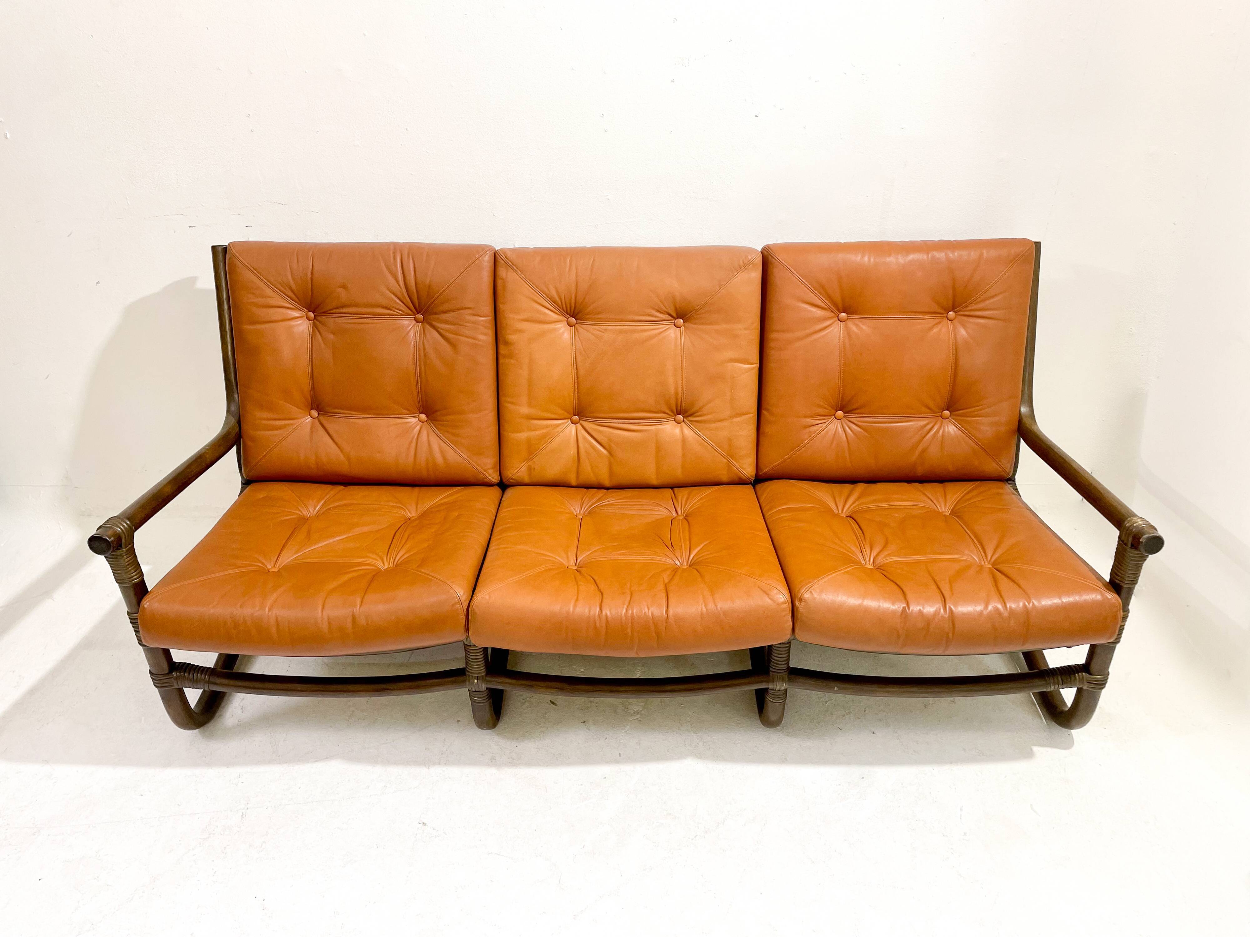 Mid-century modern rattan and cognac leather sofa