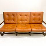 Mid-century modern rattan and cognac leather sofa