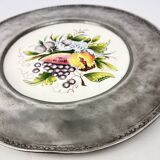 Decorative earthenware and pewter wall plate with fruits