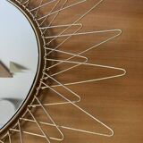 Sun mirror in gilded metal