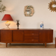 Scandinavian teak sideboard, 230 cm long, with 3 doors and 4 drawers.
