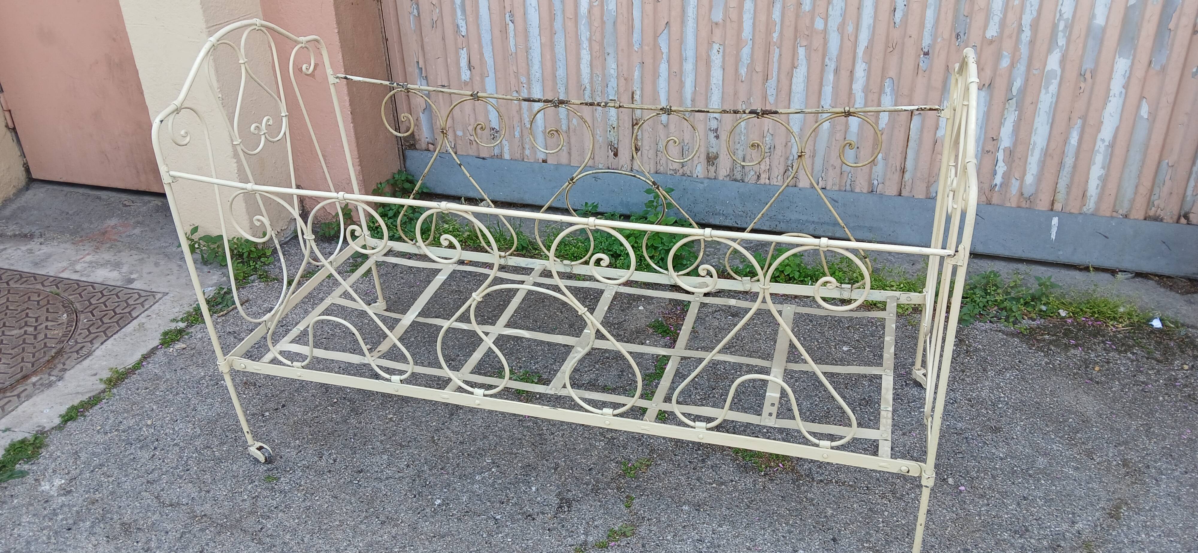 Magnificent bench/antique wrought iron bed.