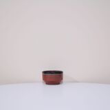 Brown bowl with a green and blue design