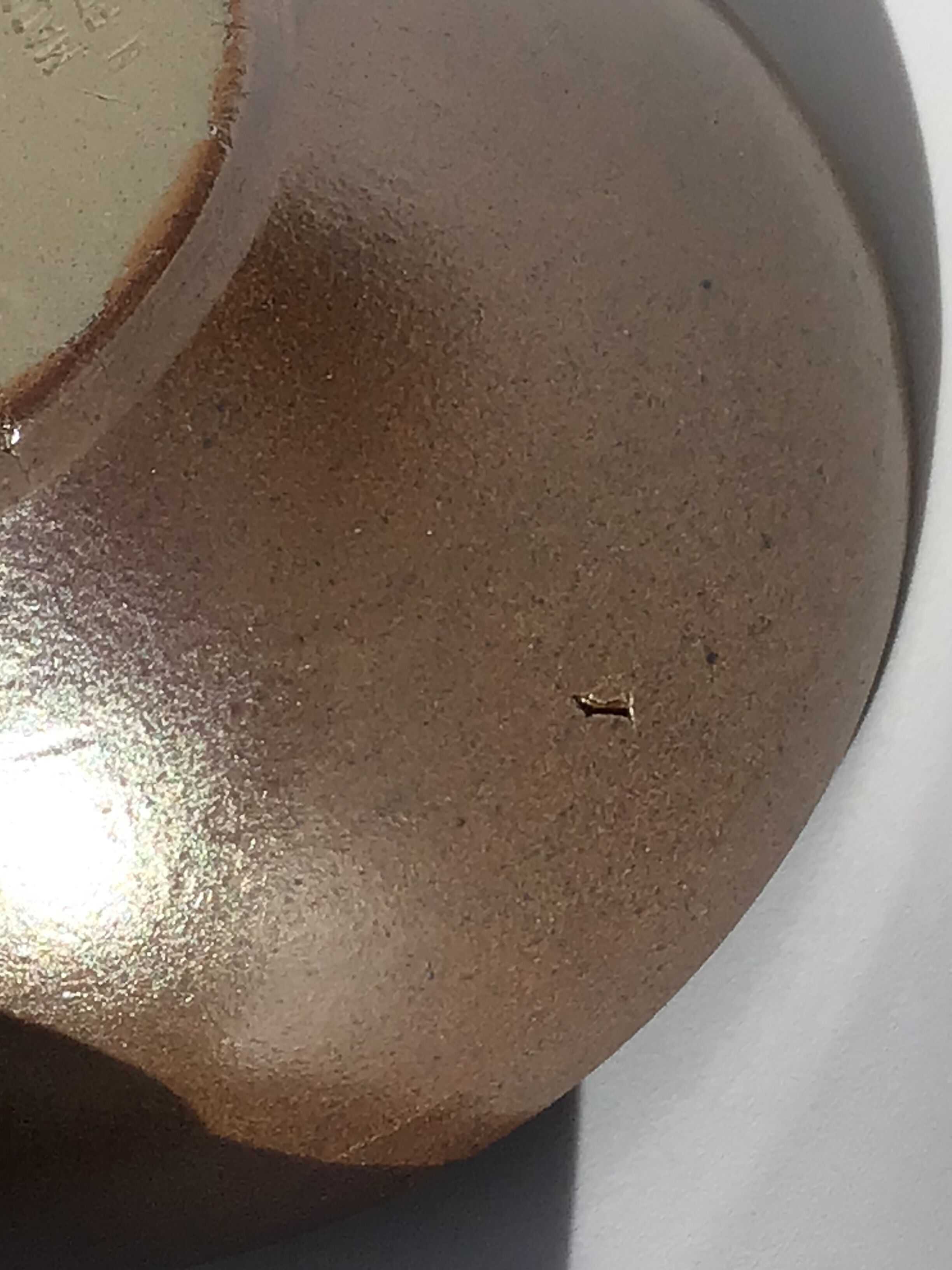 6 iridescent brown sandstone bowls inside grey