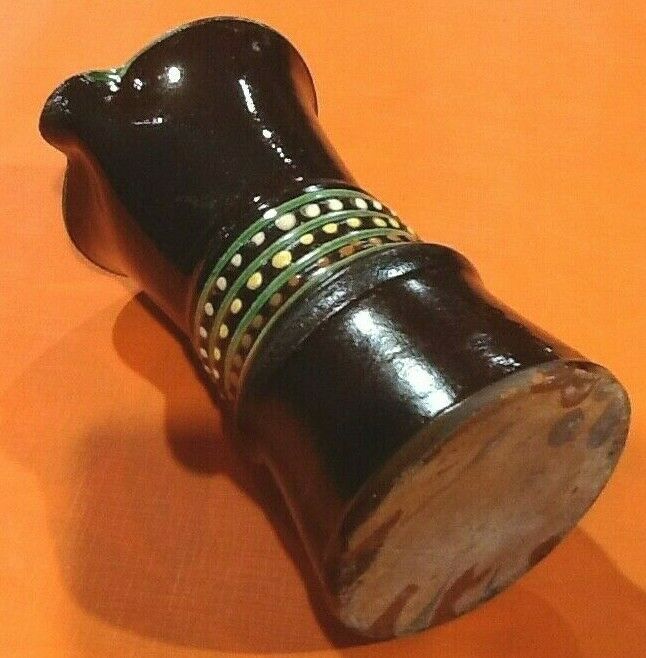 Glazed terracotta pitcher decorated with beaded friezes