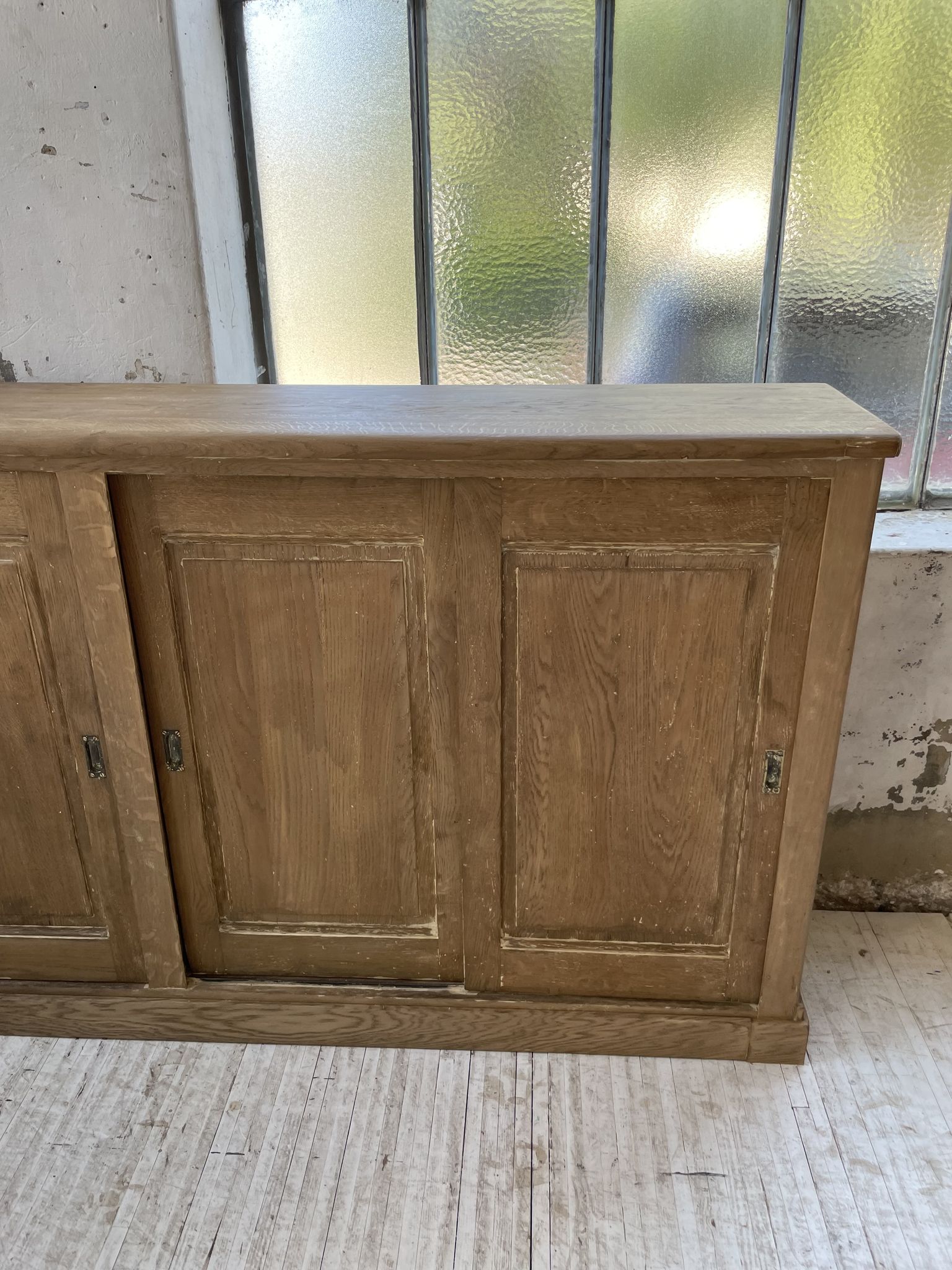 Large row of solid oak loom sliding doors