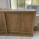 Large row of solid oak loom sliding doors