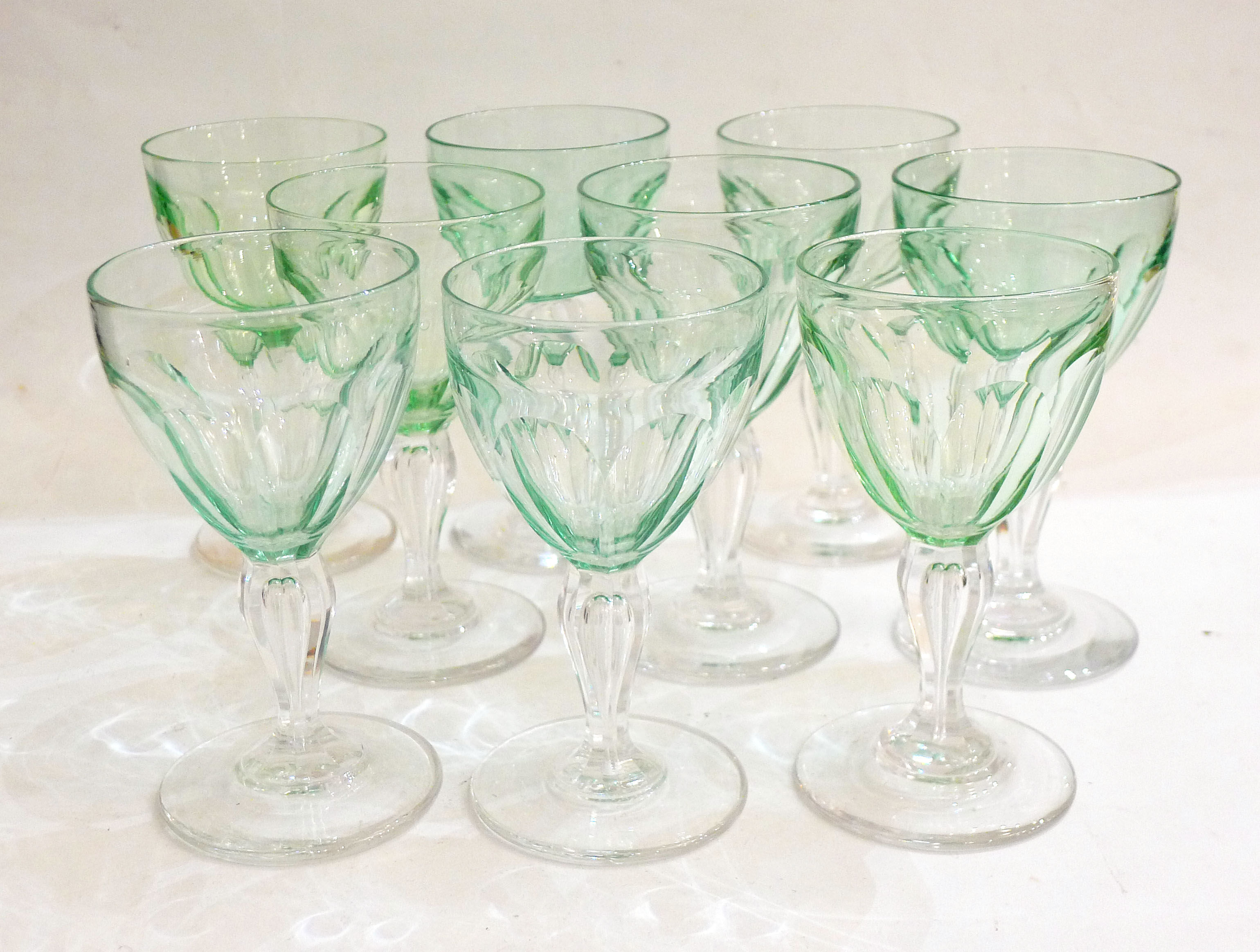 Set of nine glasses on foot in cut glass