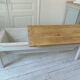 Coffee table made from an authentic farmhouse table, leg patinated pearl gray