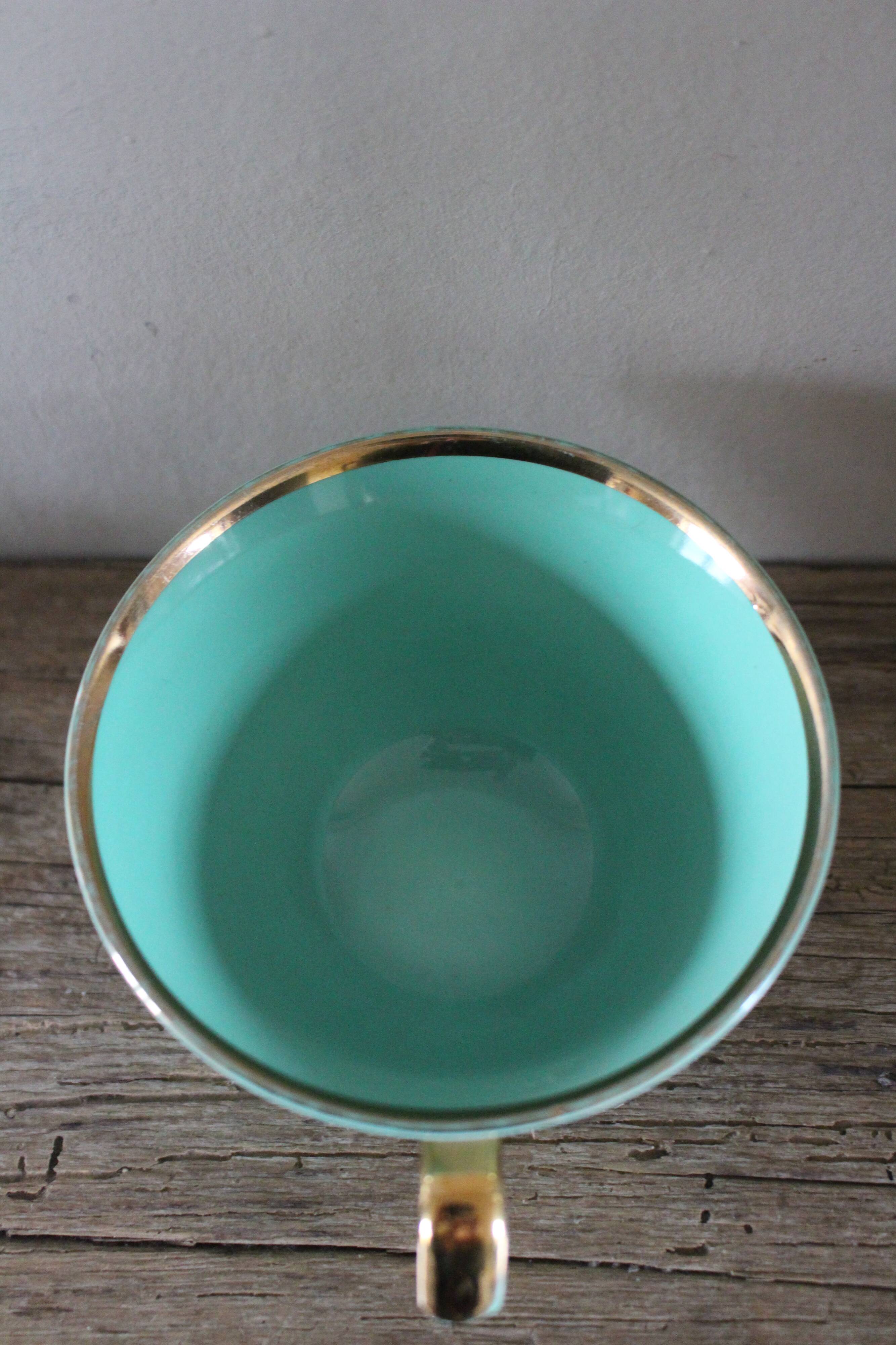 Green and gold cup from the Moi Salins collection.