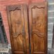 Paire de portes de placard style Louis XV en merisier massif